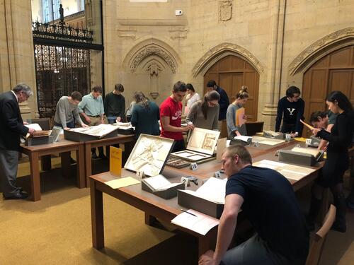 Students with primary sources in the Gates classroom located in Manuscripts and Archives