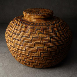 Coiled basket with cover.
