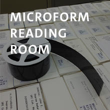 Microform Reading Room, reel of microfilm on opened drawer
